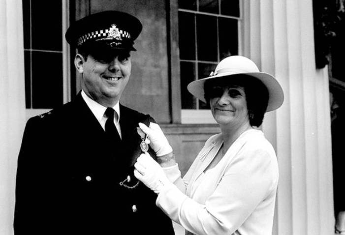 Honoured: PC Trevor Lock, with his wife, gets the George Medal in 1981 (Public Domain)